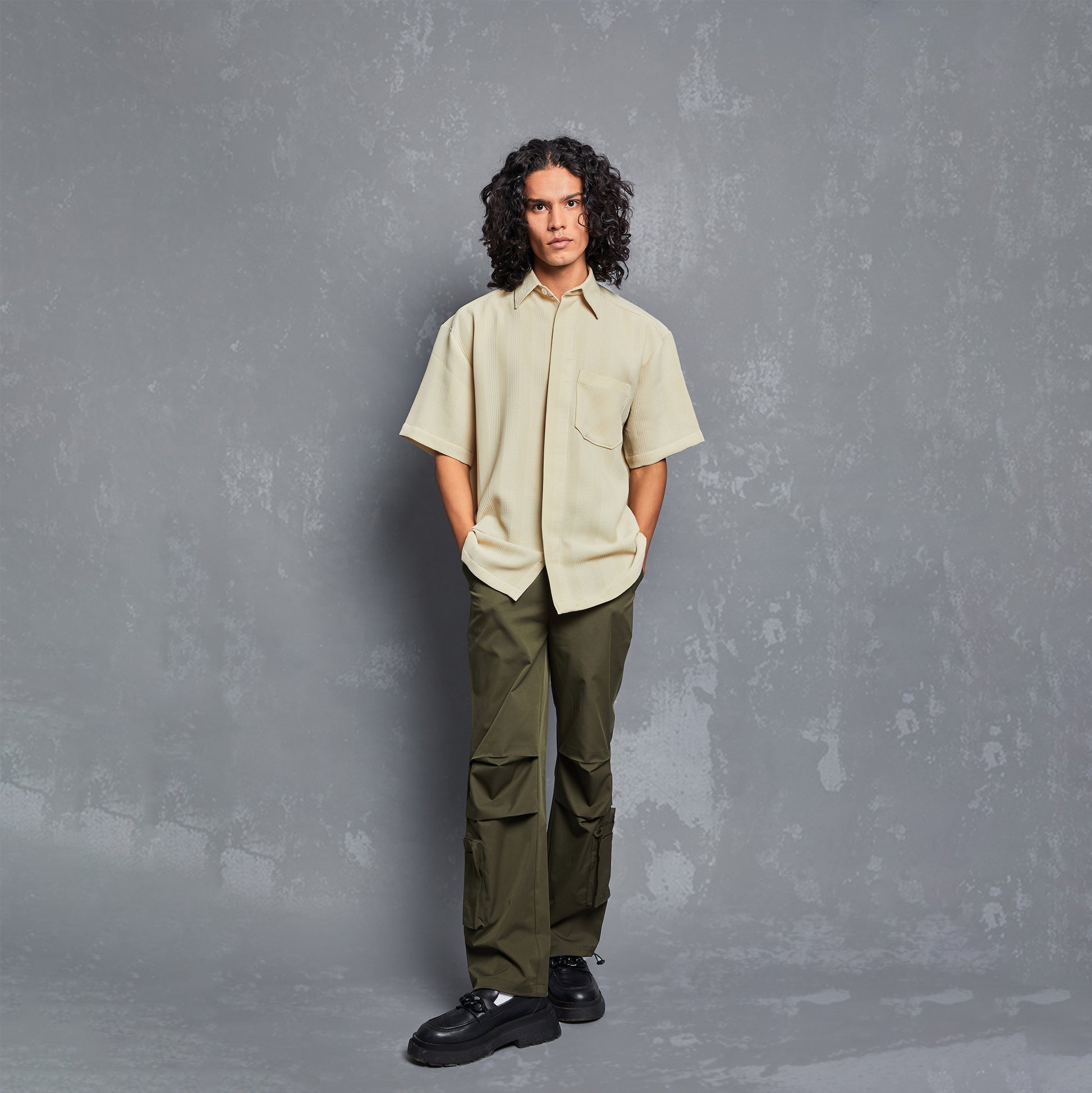 model, editorial, waffle chceks detailing, rich polyester fabric, one piece cuban style collar, polyester shirt for men, polyester shirt for women, unisex, straight fit, relaxed fit, mens fashion, womens fashion, pock details, people also ask