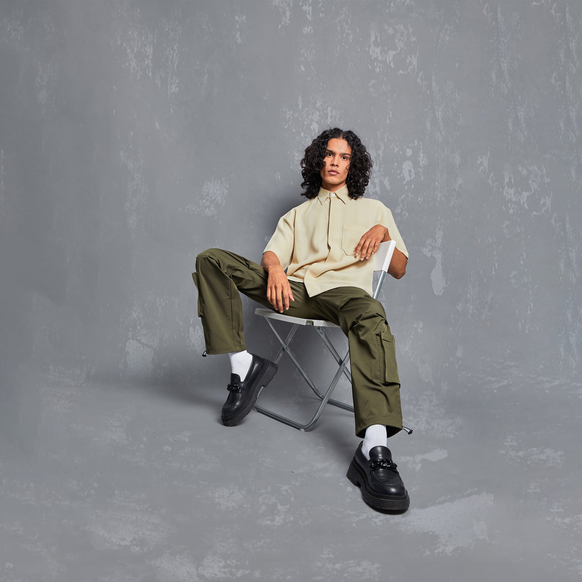 model, pose, editorial, inega, inega india, waffle checks detail fabric pocket, rich polyester shirts for men, rich polyester shirts for women, shirt with olive cargo pants, californian shirt, cuban collar, half sleeve shirt, half sleeve shirt for women, half sleeves shirt for men, streetwear, streetwear style, inspiration, outfit inspo, people also ask