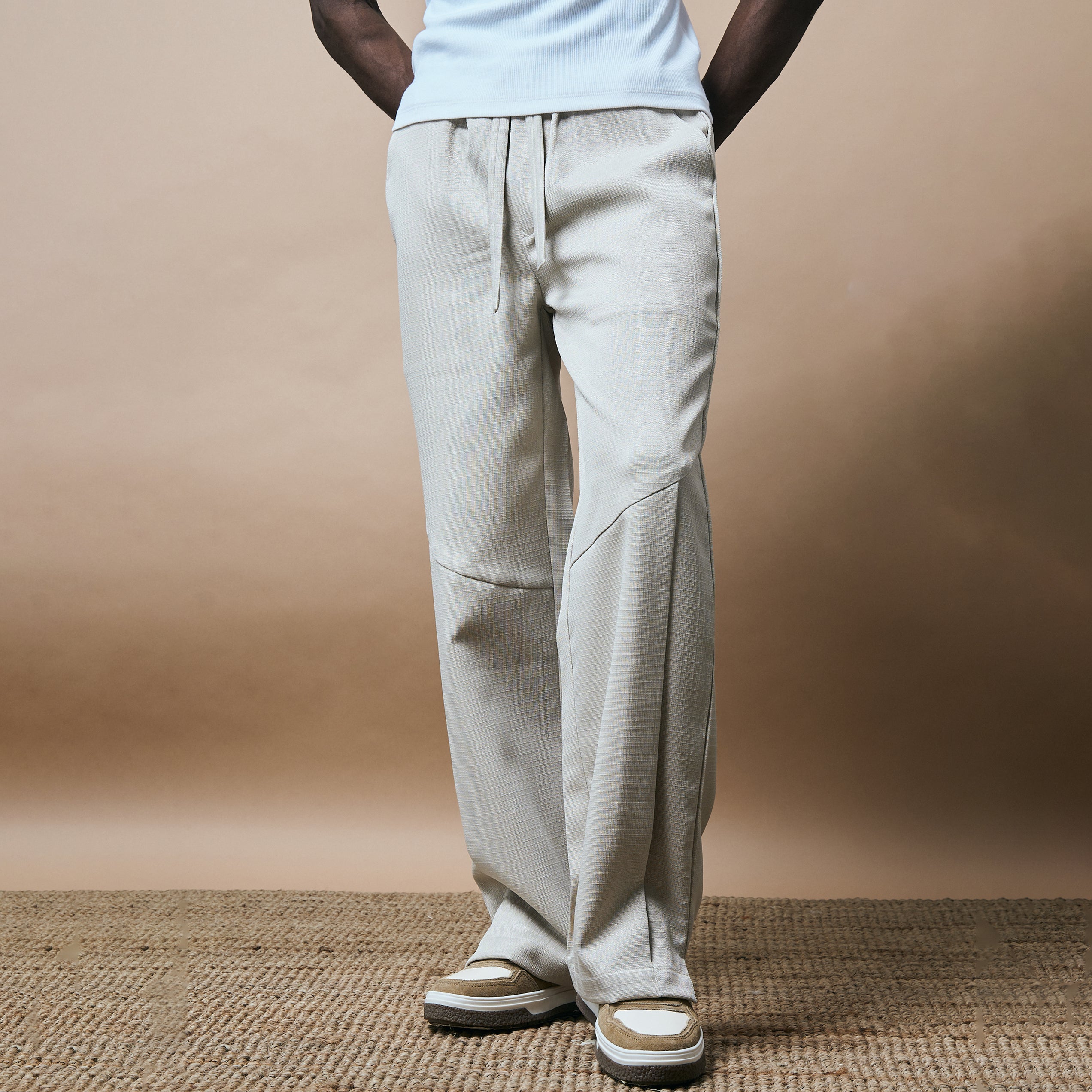 PLEATED ARCH CUT PANTS - BISCUIT