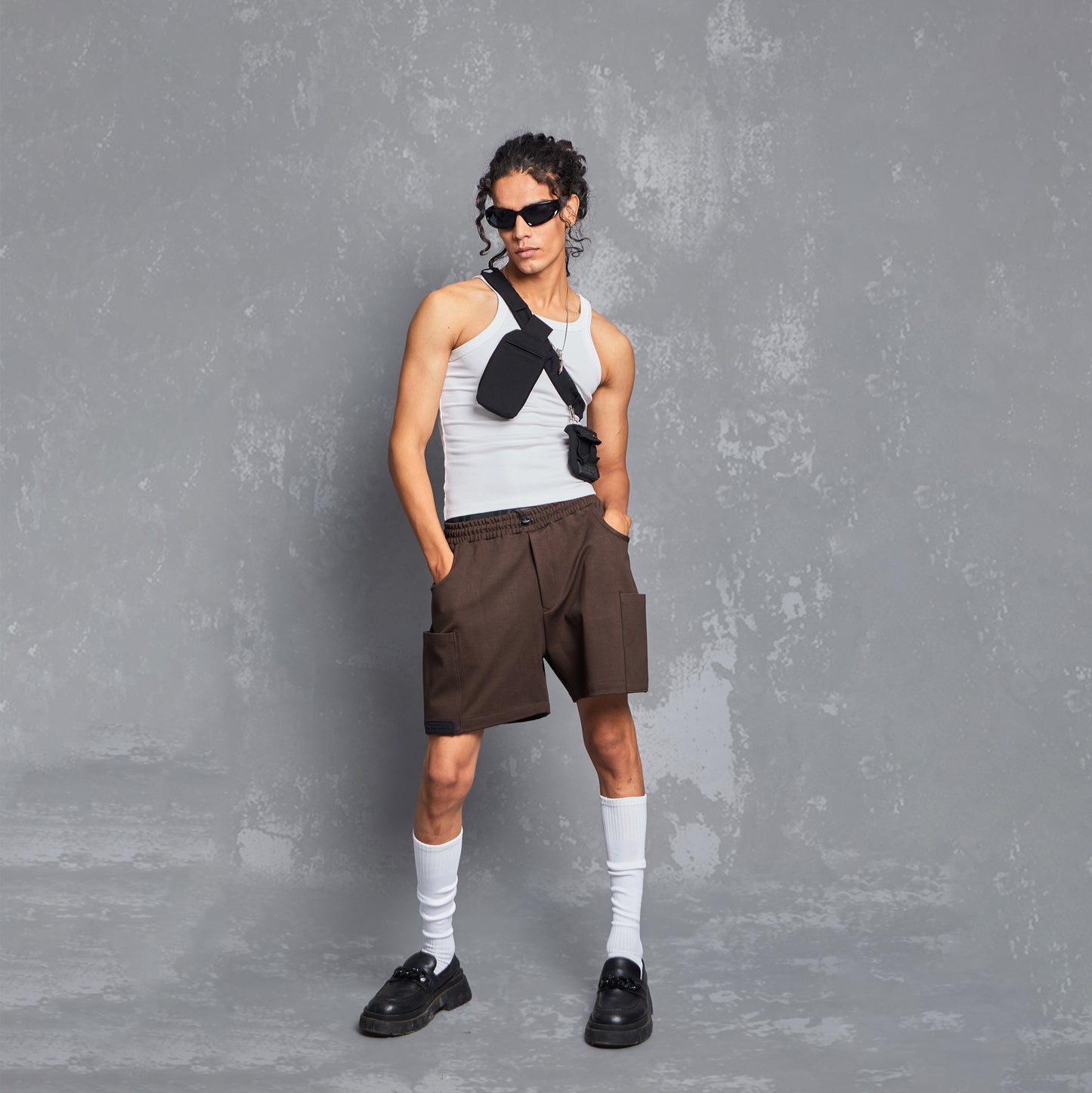 model, spring / summer 2023, warping theories, collection, lifestyle, smart casuals, brown shorts, men's shorts, every day outfit, styling inspiration, utility pocket, waistband, people also ask
